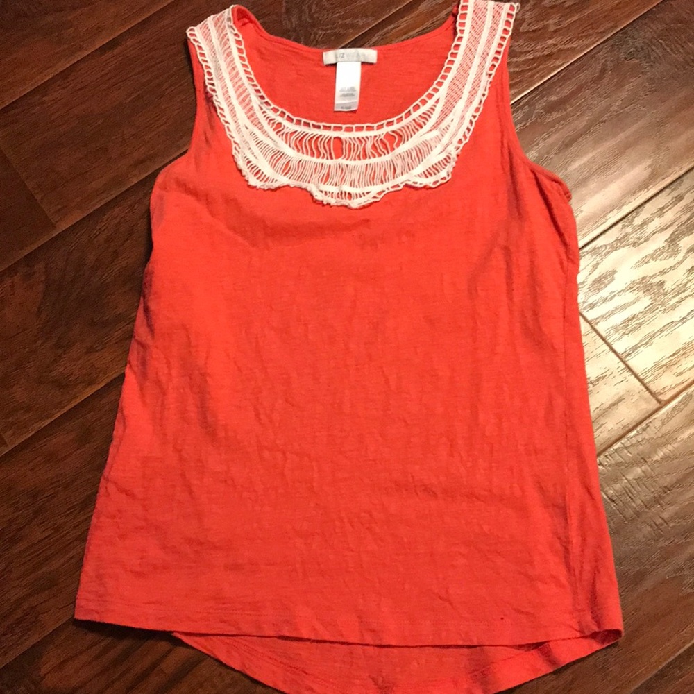 Orange tank top with decorative neck.